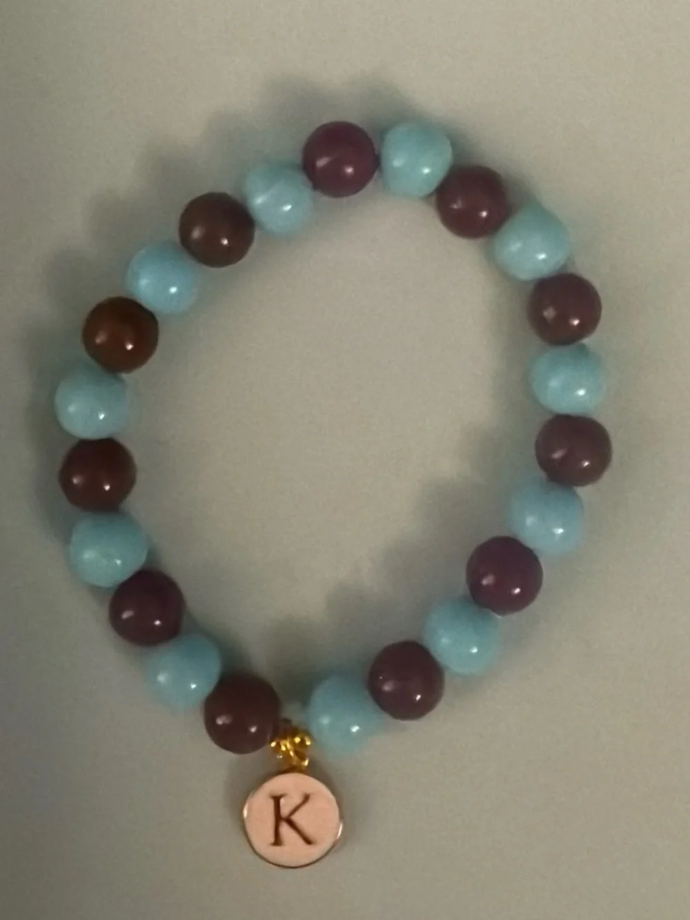 Initial ‘K’ Charm Beaded Stretch Bracelet in Light Blue and Plum